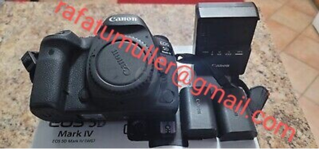 Canon EOS IV available with Len's box black - 2/3